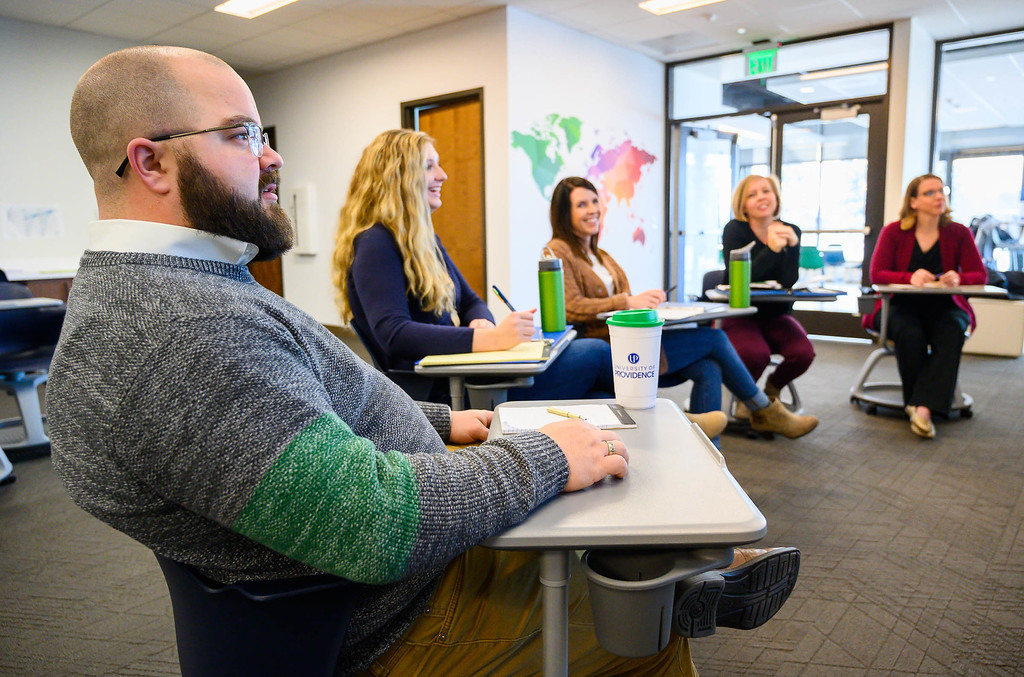 People watch a presentation in Great Falls, MT