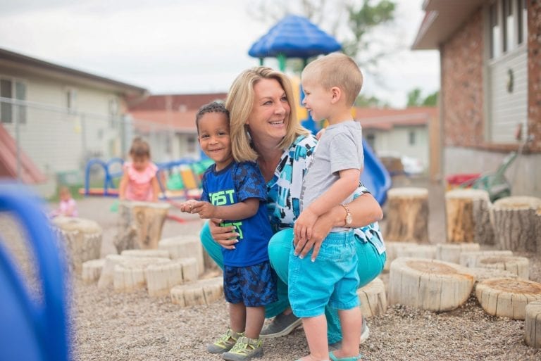 Play N Learn owner with two children